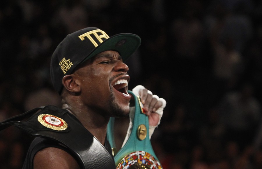 Mayweather Jr. of the U.S. celebrates his victory over Alvarez at the MGM Grand Garden Arena in Las Vegas