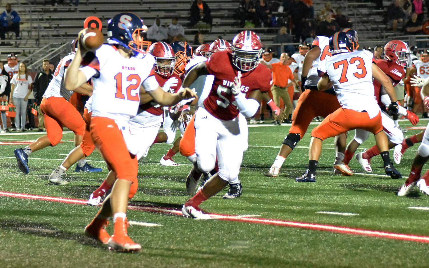 Defensive powerhouse
Senior defensive end Charlie Brooks chases senior quarterback Robbie Hansen during their game on Sept.7 against Stagg. Brooks has interest from colleges like University of St. Francis and Ball Sate University.