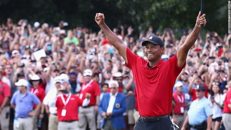 Tiger+Woods+smiles+and+celebrates+after+winning+the+Tour+Tournament+in+Atlanta+on+Sept.+24.+It+was+his+80th+PGA+Tour+win.