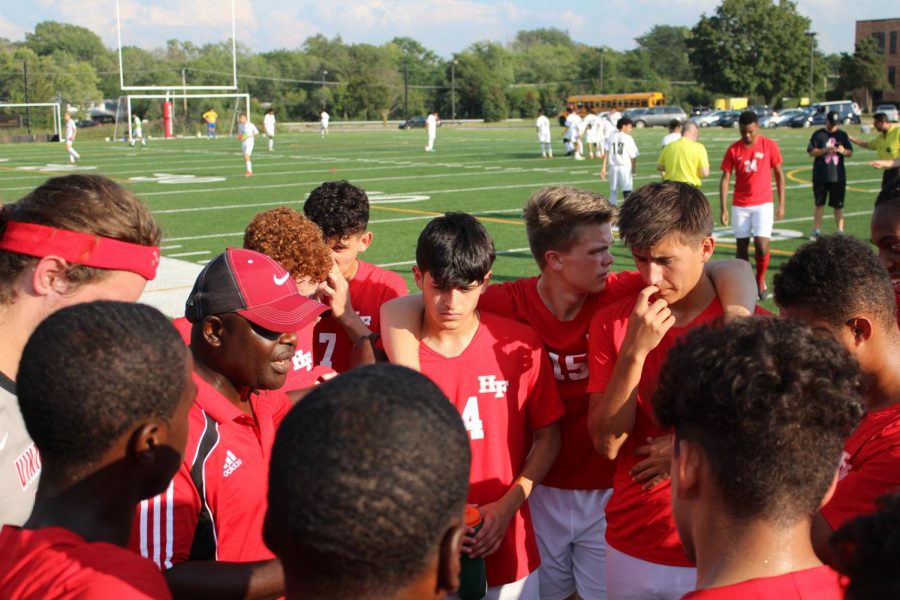  Assistant Coach Emmanuel Ali gives his team a pregame speech before their first home game against Richards last Thursday. The Vikings went on to beat the Bulldogs 2-0.