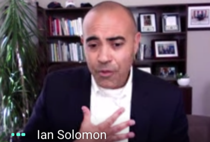 Dean Ian Solomon virtually speaking to IB students through a Google Meet. 