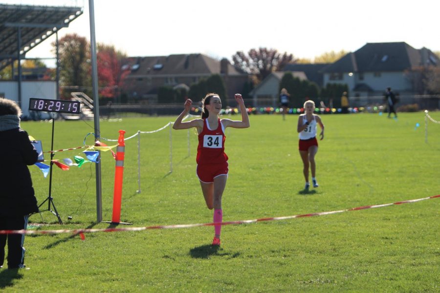 Schoen crosses the finish line to win the 3A Tinley Park Regional.