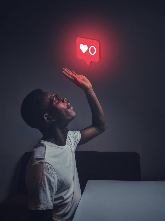 In the photo taken and created by Oladimeji Ajegbile, a man can be seen crying over  instagram likes. Which shows how people care way too much about social media.