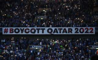 Protesters hold up banner during World Cup game.