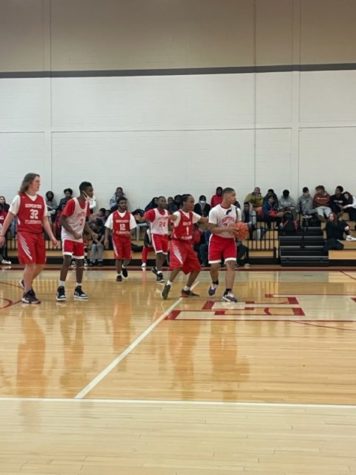 H-Fs Unified Basketball program beating Rich Township 32-38 on 12/6