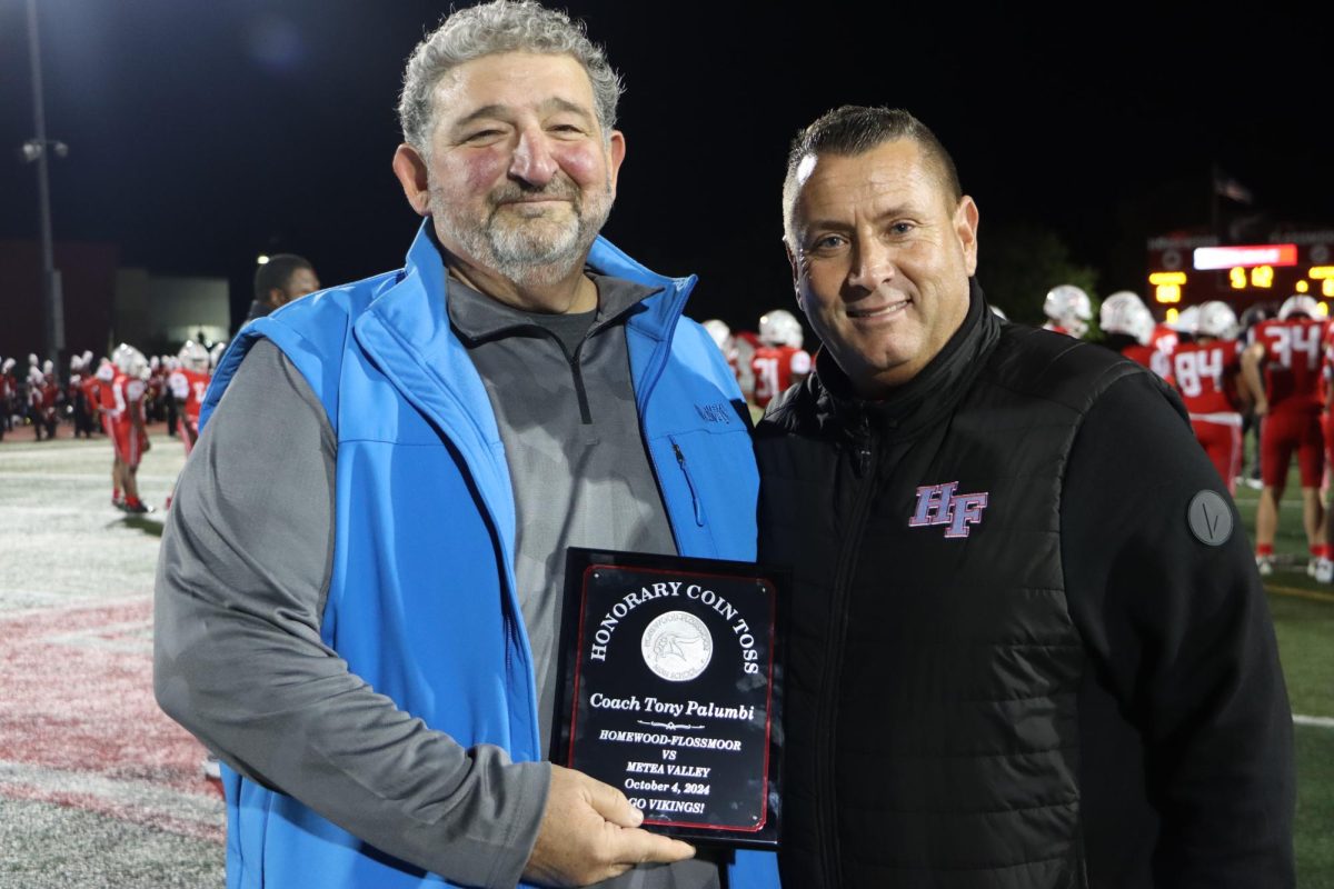 Coach Tony Palumbi with athletic director Matthew Lyke after the coin toss at the Metea Valley game.