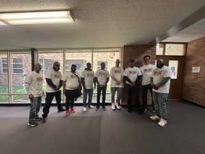 A group of fathers posing at the Dad Squad event.