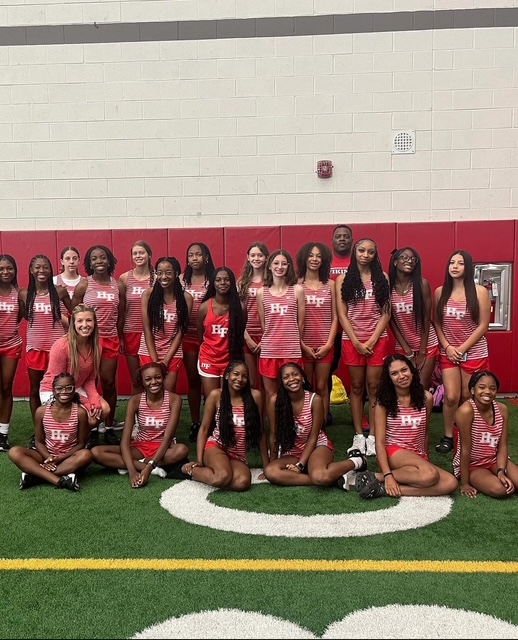 A group photo of the HF varsity girls' cross country team.