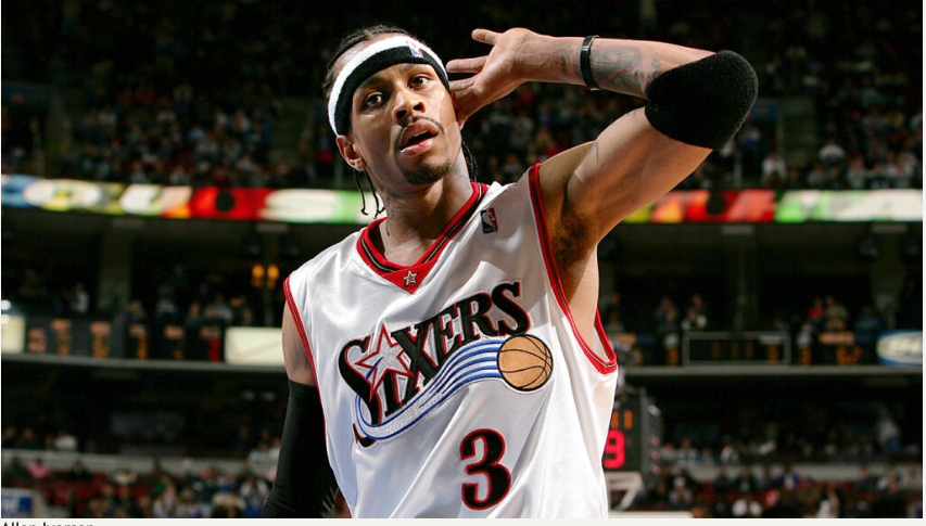 Allen Iverson doing his signature hand to ear gesture 