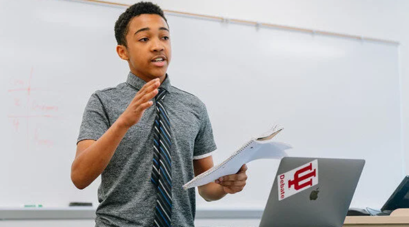 Student Gregory Mitchell competing at a debate tournament 