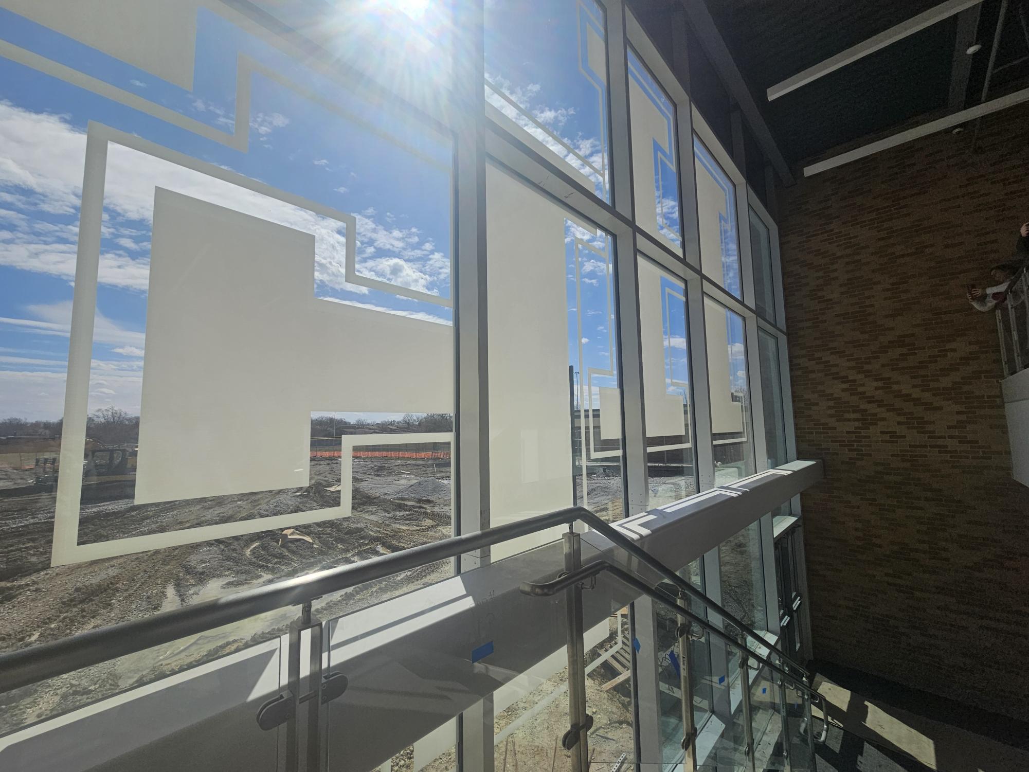 Window in the new science wing with the HF logo on it.