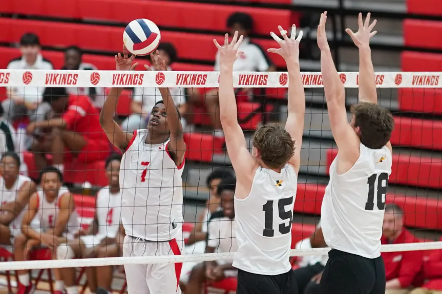 Freshman Surendran Heyward putting up a set at the net against Andrew on May 1.