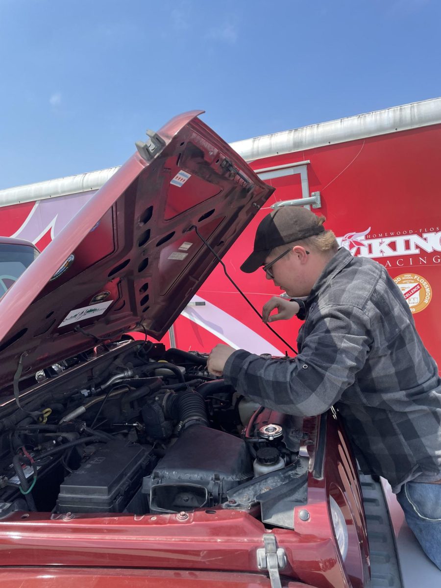 Senior Jackson Grage repairing a car for his Automotive class.