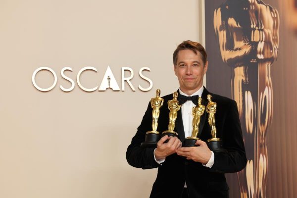 Independent Filmmaker Sean Baker poses with awards following Oscar sweep