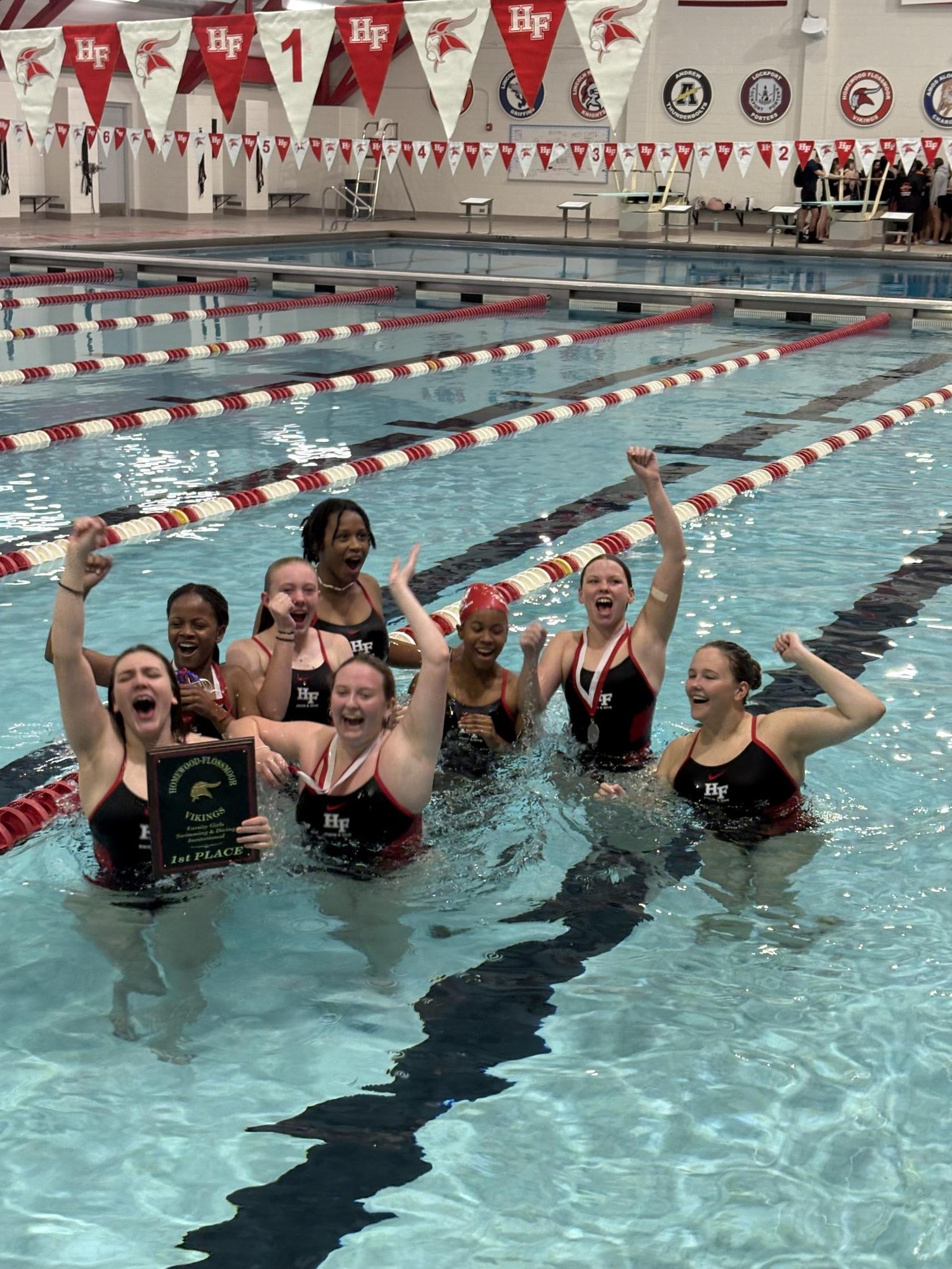 H-F Girls Swim team celebrates after the Invitational win. 