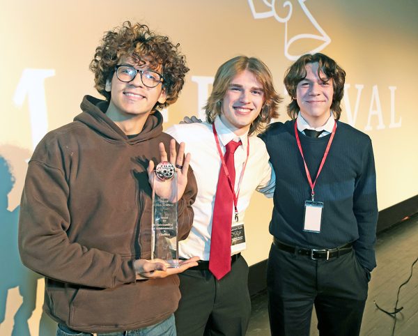 Homewood-Flossmoor High School students (L to R) Anthony Reynoso, Joseph Klauk, and Charles Wachtel, winners of the Student Silent Film Festival for the film titled “The Silence Between Us” at the 2026 Student Silent Film Festival held at the Tivoli Theatre.