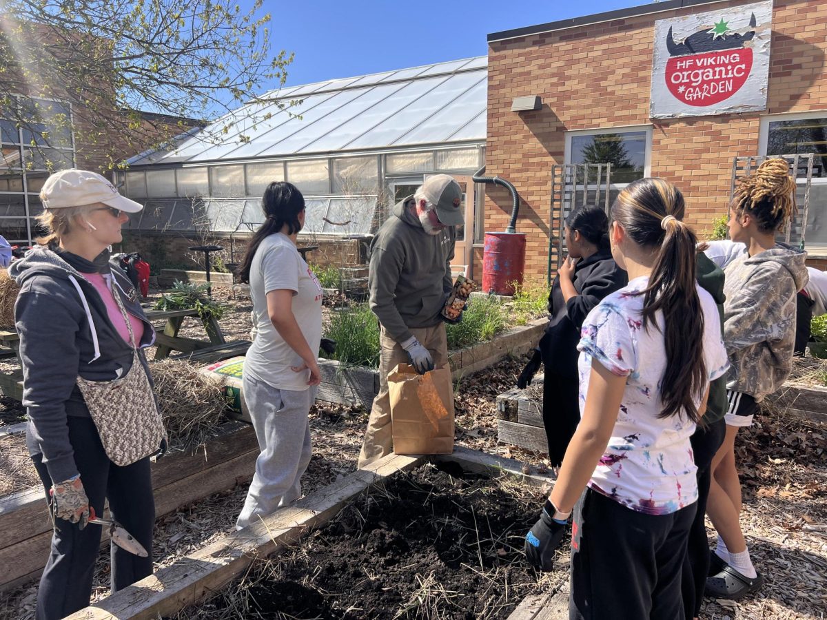 Clean up! Community helps organize the garden.