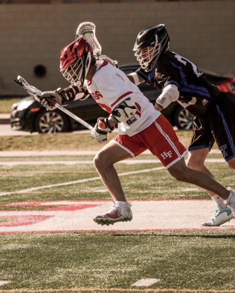 Stickin' it! Former H-F Lacrosse midfielder Jacob Sline evades the defense in 2024.