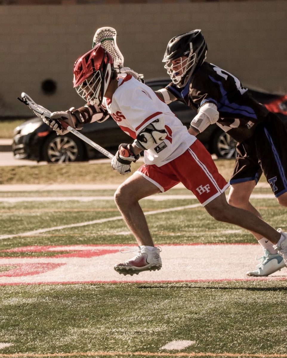 Stickin' it! Former H-F Lacrosse midfielder Jacob Sline evades the defense in 2024. 