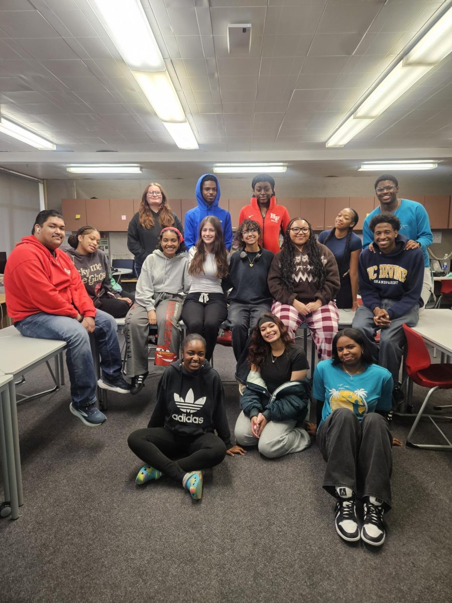 Huddle together Voyagers! The Voyager staff takes a group photo to remember each other after graduation