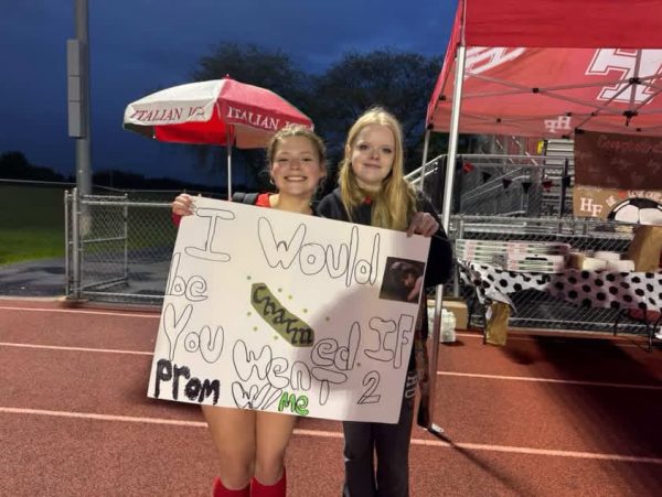 Senior Maggie Stapleton receives a promposal from friend Alex Cordero.